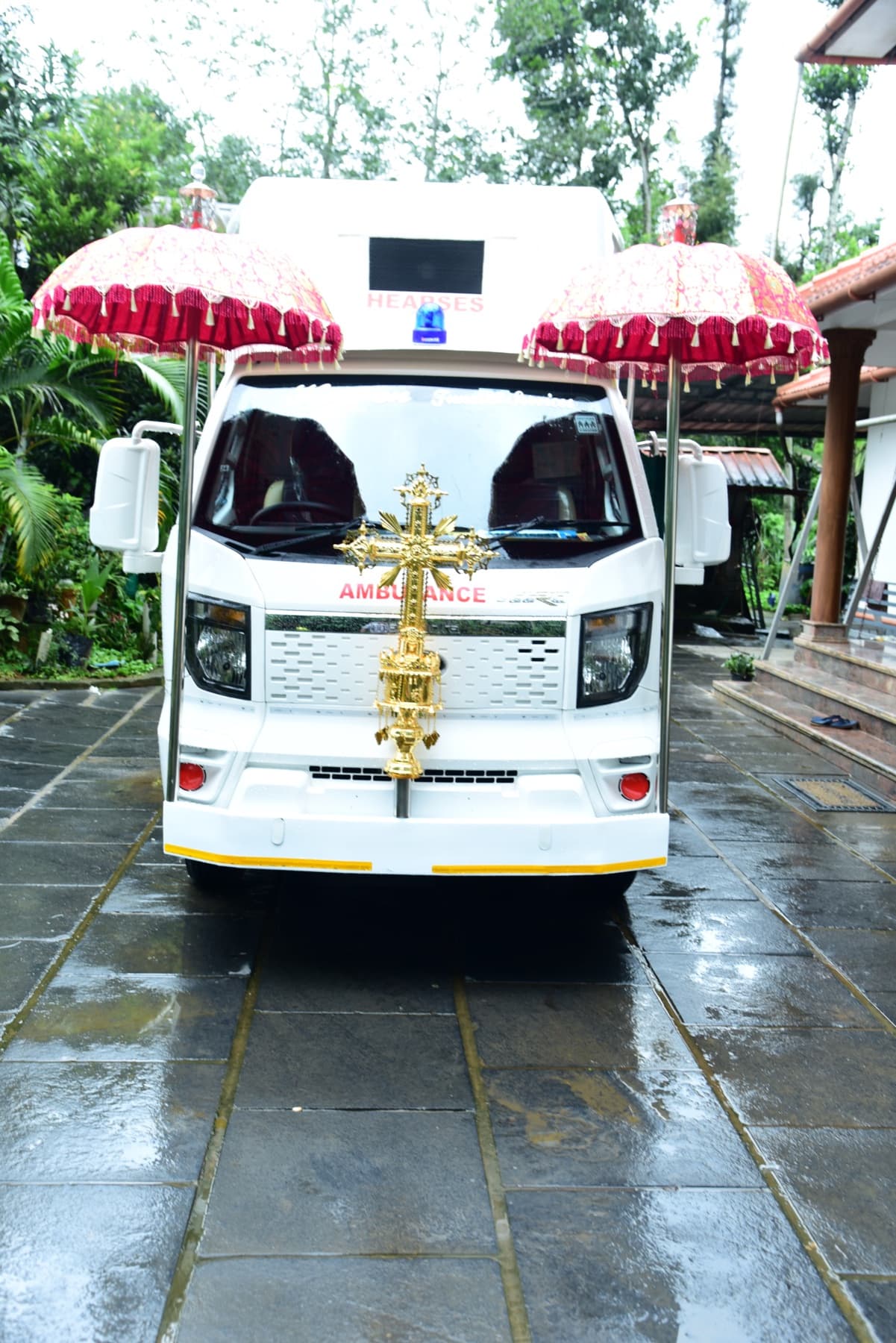 Front view of the white Heaven Funeral Services transport vehicle
