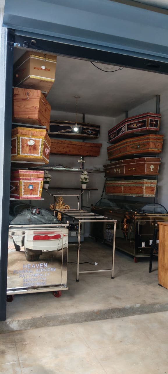 Branded Heaven Funeral Services mobile freezer unit at the showroom entrance